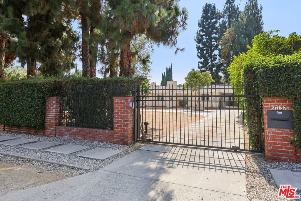 Welcome to this charming 3-bedroom, 2-bathroom gem nestled in the highly sought-after neighborhood of Van Nuys. Boasting a bright and open floor plan, this home features a fireplace and expansive living and dining areas ideal for both relaxing and entertaining. The inviting eat-in kitchen is well-equipped with appliances, ample cabinet space, and a convenient in-home washer and dryer.The oversized primary suite offers a generous layout and a spacious bathroom, creating a perfect retreat. Enjoy the added peace of mind and privacy with gated access and on-site parking for up to 5 cars. Step outside into your very own private oasis large front and backyard with a sparkling pool, ideal for weekend barbecues, summer parties, or simply enjoying the best of Southern California outdoor living. Prime location just moments from shopping, dining, entertainment, and with easy freeway access. This home is a rare find and easy to show. Don't miss your chance to call it your own!