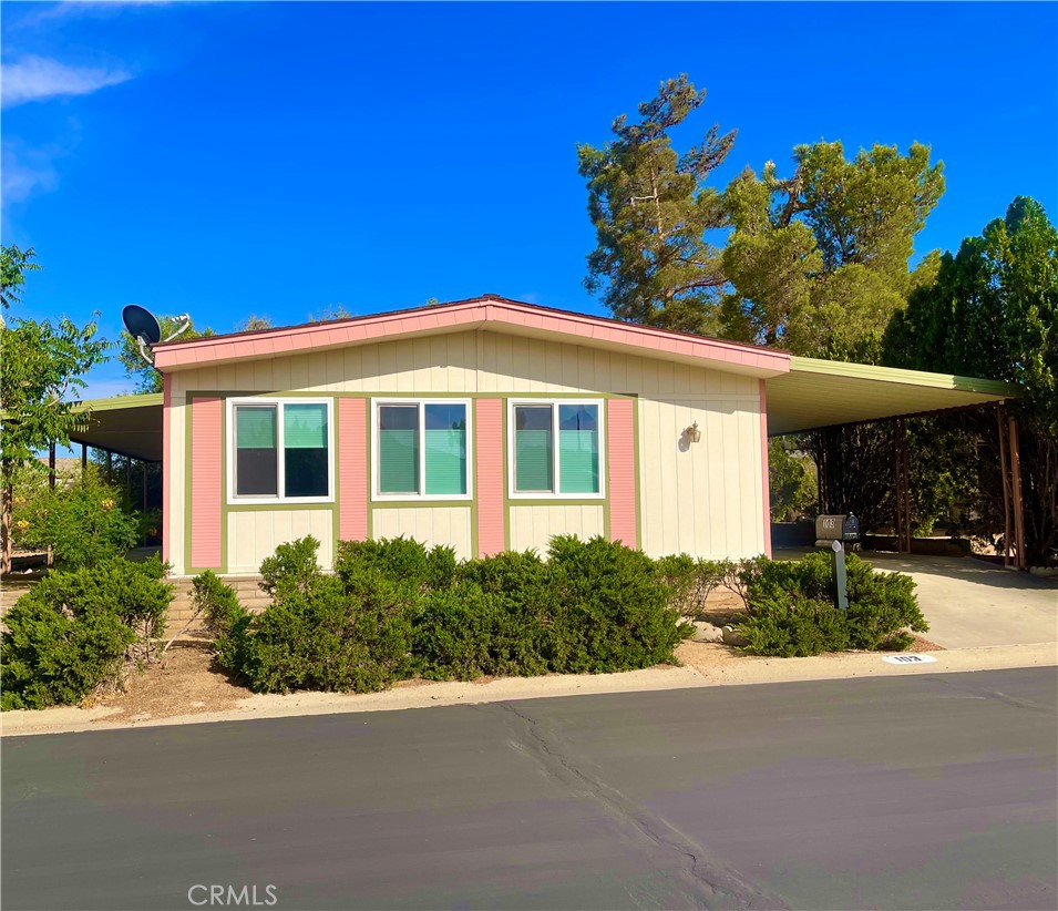 New carpeting, New double pane windows, New window coverings! Welcome to this charming 2 bedroom, 2 bath manufactured home situated on a spacious lot in the serene and well-maintained Gates of Spain 55+ Community. From the moment you arrive, you’ll appreciate the thoughtful features this home offers—starting with a long covered carport for your vehicle, a tidy storage shed for your tools and extras, and a freshly painted concrete walkway leading to a cozy front porch that's perfect for morning coffee or evening relaxation.
Step inside and be greeted by a warm and open floor plan, complete with wood-paneled walls and classic built-in cabinetry that bring character and comfort to every corner. Whether you're a fan of retro charm or looking for a blank slate to modernize, this home offers the perfect foundation to make your vision a reality.
The spacious living room is bathed in natural light from multiple large windows, offering plenty of room for both relaxing and entertaining. The adjacent dining area easily accommodates a large table and connects seamlessly to the generously sized kitchen. Here you’ll find clean appliances—including a gas cooktop, wall oven, and refrigerator—as well as ample counter space and solid wood cabinets for all your culinary needs.
Just off the kitchen, a convenient laundry room doubles as a hobby space with extra counters, cabinetry, and even a built-in desk. A brand new sliding glass door opens from the laundry area onto the covered side patio—perfect for enjoying the outdoors with privacy and shade.
The first bedroom is well-sized with a deep closet and easy access to a guest bathroom featuring a walk-in shower. The primary suite is a true retreat, complete with a spacious layout, oversized closet, and an en-suite bathroom that includes a large soaking tub, extra storage, and plenty of counter space.
This delightful home offers exceptional value, comfort, and potential in a peaceful senior community with well-kept grounds. Don’t miss your chance to make it yours—schedule a tour today!