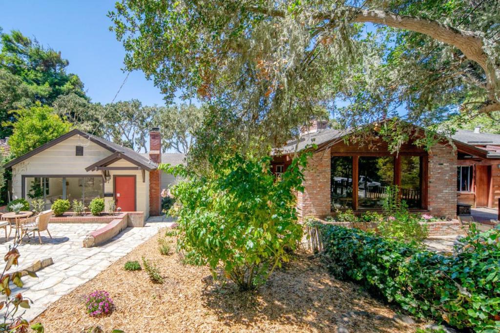 Welcome home to Cheerio Tipp and The Little House--a legacy property in Carmel-by-the-Sea, offered for the first time in generations. This rare opportunity includes two houses on separate lots, totaling 9,663 sq ft, with individual parcel numbers and utilities. The larger Cheerio Tipp is rich in charm and lore. The family owned the first television in the neighborhood; friends and neighbors often gathered around to enjoy. On the main level, vaulted ceilings and old-growth redwood interiors create a warm, inviting atmosphere. Period details remain throughout--including a built-in pipe rack, a hidden safe, and cleverly concealed storage closets. A primary suite, spacious great room, eat-in kitchen, and loft with peeks of the Pacific complete this floor. Downstairs offers a full laundry room, guest suite, and two-car garage. Next door, "The Little House" sits on a 4000 sq ft lot and includes two bedrooms, one bath, a cozy living room with fireplace, and a generous deck. Both homes enjoy Carmel stone patios, garden space, and spots to sip morning coffee or dine al fresco. Just blocks from downtown shops, restaurants, galleries, and Carmel's white sand beaches, this is a rare chance to continue a cherished legacy and become the next custodian of an extraordinary double-lot property.
