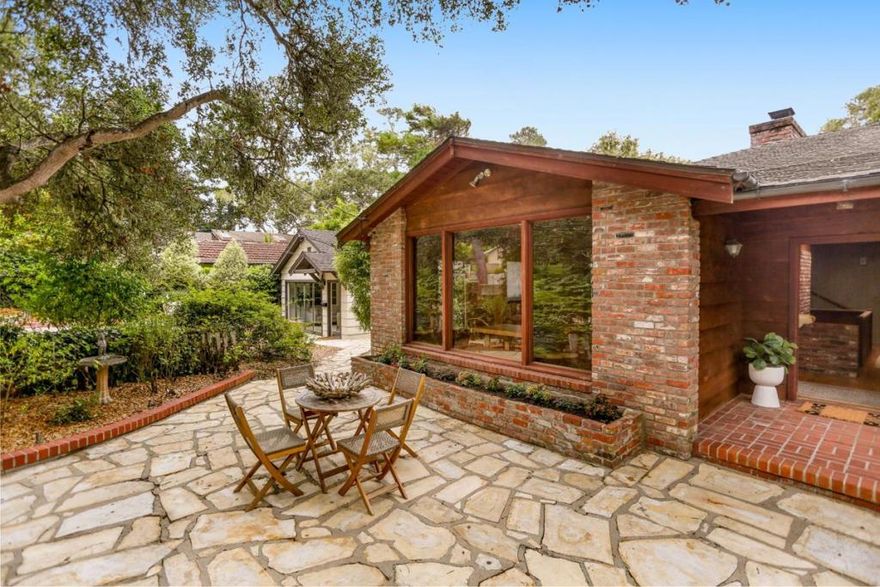 Welcome home to Cheerio Tipp and The Little House--a legacy property in Carmel-by-the-Sea, offered for the first time in generations. This rare opportunity includes two houses on separate lots, totaling 9,663 sq ft, with individual parcel numbers and utilities. The larger Cheerio Tipp is rich in charm and lore. The family owned the first television in the neighborhood; friends and neighbors often gathered around to enjoy. On the main level, vaulted ceilings and old-growth redwood interiors create a warm, inviting atmosphere. Period details remain throughout--including a built-in pipe rack, a hidden safe, and cleverly concealed storage closets. A primary suite, spacious great room, eat-in kitchen, and loft with peeks of the Pacific complete this floor. Downstairs offers a full laundry room, guest suite, and two-car garage. Next door, "The Little House" sits on a 4000 sq ft lot and includes two bedrooms, one bath, a cozy living room with fireplace, and a generous deck. Both homes enjoy Carmel stone patios, garden space, and spots to sip morning coffee or dine al fresco. Just blocks from downtown shops, restaurants, galleries, and Carmel's white sand beaches, this is a rare chance to continue a cherished legacy and become the next custodian of an extraordinary double-lot property.