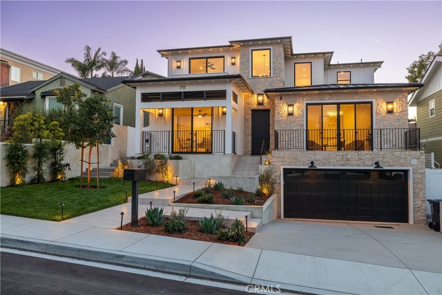 This stunning new construction ‘California Modern Farmhouse’ style home, in the highly desirable hill section of Manhattan Beach, offers 6 bedrooms, each with its own ensuite bathroom, and 7 baths, designed with an open floor plan perfect for entertaining. The grand entrance with soaring ceilings sets the stage for luxurious coastal living, leading to an open kitchen featuring Premium Thermador appliances including a 48-inch 6-burner gas range with double ovens, 36” refrigerator / 36” freezer, 24” built-in wine column and an oversized island ideal for gatherings. Custom built-in cabinetry enhances the living and entertaining areas, with ample natural lighting, and Fleetwood sliding double glass doors leading you to the outdoor fireplace, to create a seamless indoor-outdoor flow. Upper level boasts 4 bedrooms with ensuite bathrooms and a large laundry room, with an included Electrolux washer / dryer package. The primary suite is a true retreat, with a sundrenched private balcony, and boasting dual walk-in closets—one a full walkthrough—leading to a spa-like bathroom featuring Newport Brass plumbing fixtures, including dual waterfall showerheads, a standalone soaking tub, and dual vanities. In the basement, a bonus downstairs entertainment area with built in wet bar and beverage center, an additional bedroom and ensuite bath, mudroom with built in custom cabinets, storage room, attached garage, and an elevator connecting all levels, add to the home’s convenience and sophistication. Additional home features include a 4.4 kW solar power system, central vacuum, three zone A/C, 2 tankless water heaters, and 3 car garage with epoxy floor and prewired for EV charger. Located in a prime Manhattan Beach neighborhood with award winning schools, this architectural masterpiece blends modern elegance with coastal luxury—a must-see for discerning buyers.