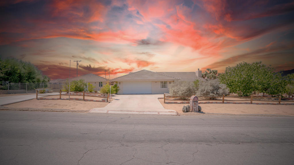 Two Homes, One Exceptional Opportunity!Set on a spacious corner lot in Yucca Valley's prestigious Upper Sky Harbor neighborhood, this rare property offers a combined total of 3,055 sq. ft. of living space, featuring 5 bedrooms and 3 bathrooms across two residences. The main home boasts 1,815 sq. ft., while the guest house adds 1,240 sq. ft., creating the perfect setup for homeowners, multi-generational living, or savvy investors seeking strong income potential. Situated on an expansive 18,785 sq. ft. lot, this unique property delivers versatility, space, and outstanding value.The main home with 1815 sq ft of living space features three bedrooms and two bathrooms soaring vaulted ceilings that create a bright, open atmosphere in the living, dining, and family rooms. This generously sized kitchen features a convenient breakfast bar and a charming dining area, perfect for casual meals. The kitchen opens to a covered patio and outdoor retreat featuring a putting green, ornamental fountain, firepit, and dual pergolas designed for entertaining and unwinding. Additional highlights include beautiful desert landscaping for easy maintenance and beautiful curb appeal. It also includes a two-car garage with a bonus bedroom, and numerous thoughtful upgrades.The second home, a newly built 1,240 sq. ft. residence, offers modern turnkey living with a spacious one-bedroom layout. It boasts a large kitchen with stainless steel appliances, quartz countertops, open living spaces, living room, family room, a luxurious bedroom with walk-in closet, and brand-new appliances--including washer, dryer, refrigerator, and gas log stove.Both homes showcase quality finishes such as granite countertops, concrete tile roofing, and central A/C and heat. Outdoor amenities include a gas fire pit, putting green, tranquil koi pond, two pergolas, and an assortment of fruit trees. Plenty of parking for each residence, including RV ParkingWhether you're looking for a primary home with a guesthouse, a multi-family retreat, or an investment property with dual rental income, this compound delivers unmatched versatility. All just minutes from Joshua Tree National Park and some of the best scenery Yucca Valley has to offer.