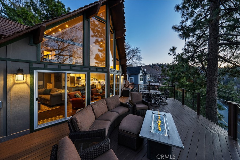 NEW PRICE! If you're seeking jaw-dropping panoramic lake and mountain views, effortless luxury and tranquility, welcome to the Surreal Feel Chalet! Tucked away in an exclusive enclave of just three homes, this dream property offers unmatched privacy and serenity, stair-free access, ample parking for at least 6 vehicles, and a rare, heated deep garage. Inside a dramatic wall of windows frame ever changing vistas like a living postcard. With over $250,000 in premium upgrades, this home masterfully blends modern elegance with mountain charm and exceptional attention to detail. Need a dock to complete the package? You're in luck! There are several docks available, including one just a short walk from the house in North Bay's calm deep waters. This home delivers the wow factor and views you have to see to believe. Offers are welcomed!
Property Highlights:
Vacasa’s #1 rental in Lake Arrowhead. https://vacasa.com/unit/94969 * Guests have access to the lake!
The property has since been professionally decorated by Allen Design & Staging and the home is being offered fully furnished as shown in the listing for sale.
Private studio with kitchenette, its own deck, and a 6-person jetted hot tub
Backup systems for ultimate safety, comfort, and efficiency:
Whole-house 22kW Generac generator
New central heat and A/C systems for the main house, one for the upper two floors can be used separately for efficiency and reduce costs and the other for the whole house, plus a new heat and A/C Minisplit in the studio
2 water heaters, a tanked and new tankless
Freshly painted exterior
Room to park your boat
Central heating in the garage
New roofing over the upper bedrooms
New waterproofed entry deck ($10K upgrade)
Fully updated kitchens (main home and studio) with 2023 appliances and three full-size refrigerators
Entertainment for all: pool, ping pong, shuffleboard, foosball, cornhole, and more
Basketball hoop to play half-court basketball out front
12 Smart TVs, including an 85" screen in the movie room
Outdoor lounge area, an 80,000 BTU fire pit (natural gas), and a BBQ with natural gas timer
Cozy gas log fireplace with timer and a Heat & Glo fireplace with accent lighting
Extra storage space in the garage cabinets, attic, and basement and snowblower included for winter ease
Add this legacy home to your list of Must-see homes for full time lake living, your private escape, or performing asset for years to come.