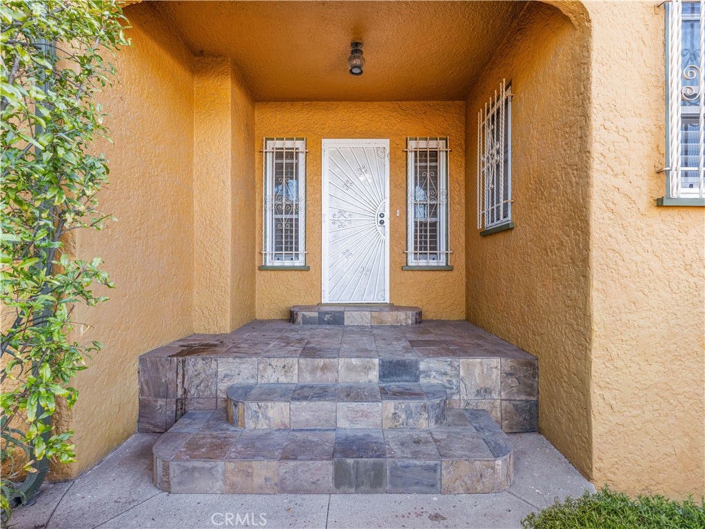 Photo of 2001 W 84th Pl, Los Angeles, CA 90047 (MLS # IV26208576)