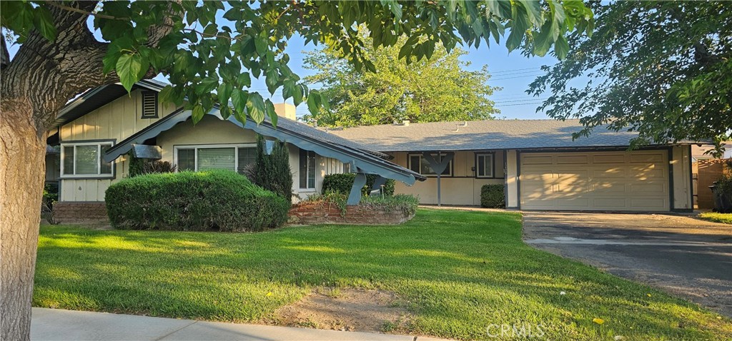 Your family is sure to enjoy this nice 3 bedroom home with a full bathroom and 1/2 bath off of the kitchen and indoor laundry room. This home also features a good size living room and dining room. A brick fireplace. Newer windows in most of the home. Nice shutters on all the windows and slider door. The large yard features block walls and cross fences with chain link. You're sure to enjoy the front yard landscaping and lush trees. Newer garage door and newer roof.