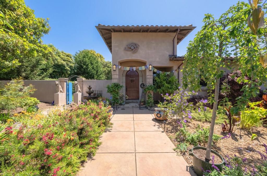 Experience the essence of La Selva Beach living in this exceptional home featuring two spacious bedrooms plus a versatile office/den. Built in 2010, this expansive 2,605 square foot residence offers a thoughtfully designed floor plan. The gourmet kitchen boasts a large island, custom cabinetry, and high-end Wolf gas range and refrigerator appliances, perfect for culinary enthusiasts. Throughout the home, discover hardwood floors, two cozy fireplaces, and a sophisticated wine bar. The master bedroom retreat includes a gas fireplace, en-suite bath with double sinks, a luxurious shower, and dual walk-in closets. Outside, the large double lot provides a tranquil setting with a fire pit, relaxing hot tub, separate outdoor shower, and a spiral staircase leading to a private rooftop terrace. Ideal for outdoor entertaining, enjoy a fully equipped kitchen for family gatherings, a Bocce ball court, and garden area. This warm and inviting residence offers coastal charm and the flexibility to create your ideal space.
