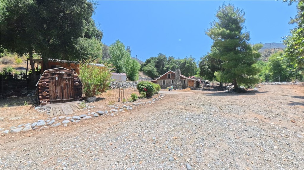 Don’t miss your chance to own a slice of paradise! Escape to the serene beauty of nature with this one-of-a-kind property, perfectly tucked away for ultimate privacy yet still within reach of city conveniences. Surrounded by towering trees, flowing river and breathtaking vistas. This home offers the perfect blend of rustic charm and modern comfort. Located in a secluded area of Azusa Canyon on the San Gabriel River. 2.66 acres in area consisting of two separate parcels - APN #8678008006 - 68,691 sq ft & APN #8678008003 - 47,250 sq ft: 115,941 total property is two side by side lots. Whether you’re hosting extended family, welcoming friends for a weekend escape, or creating a multi-generational living arrangement, each residence offers its own complete living quarters. Allowing guests to stay overnight or for extended periods while maintaining their own privacy and independence. From holiday gatherings and summer barbecues to quiet winter retreats, this property is designed to bring people together while giving everyone their own sanctuary. This estate has played host to major chain catalogue photo shoots, weddings, milestone birthdays, and multiple special events, thanks to its striking scenery and versatile layout. Its charm and functionality make it equally suited for intimate family gatherings or high-profile productions. With fresh air, endless outdoor activities, and room to roam, it’s a perfect blend of connection and escape. Remember to view the attached video of this once in a lifetime opportunity.
