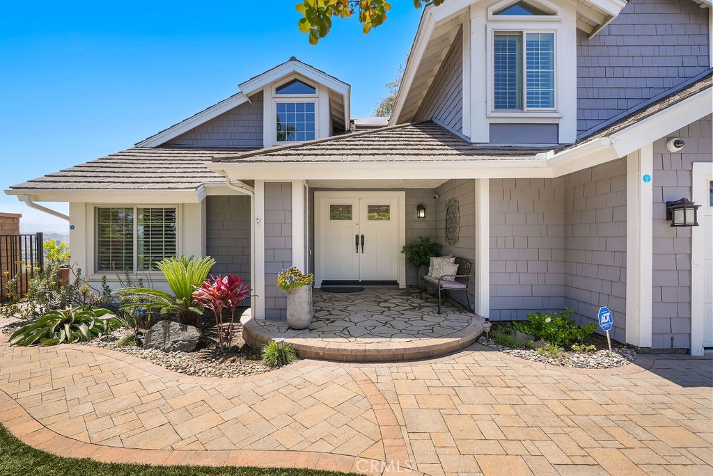 Breathtaking tropical paradise nestled in a private cul-de-sac on a 13,000 square foot lot with a stunning view!
Welcome to this beautifully upgraded 4-bedroom, 3-bathroom home nestled at the end of a quiet cul-de-sac in one of Laguna Niguel’s most desirable neighborhoods. Situated on an exceptionally large and private 13,000 sq ft lot—rare for the area—this 2,230 sq ft residence offers the perfect blend of modern convenience, luxury, and privacy. 4the bedroom is setup as an executive office.
Step inside to discover a thoughtfully remodeled interior featuring wood floors, plantation shutters, and an upgraded kitchen and baths. The home is equipped with a smart home system, including internet-controlled doors, lights, and a remote-access 5-camera security setup for peace of mind.
The outdoor space is an entertainer’s dream. A resort-style pool and spa feature programmable color-changing lighting, a serene water feature, and full internet control. Enjoy gatherings around the massive built-in BBQ island, complete with a refrigerator, warming stove, pizza oven, and outdoor TV—surrounded by custom pavers and lush, low-maintenance landscaping on a full drip system.
Relax under the stars while enjoying sweeping eastern views of city lights and mountains. The home is equipped with a long, private paver driveway, newer dual-pane windows, a brand-new HVAC system, a steel roof, and fully paid solar panels that bring your electricity bill down to zero.
Additional highlights include built-in speakers, leaf-filtered gutters, and a gentle ocean breeze thanks to its ideal location just outside the fog line. You’re just minutes from top-rated schools, shopping, dining, and easy freeway access.
This home is truly a rare gem—designed for comfortable living and unforgettable entertaining.