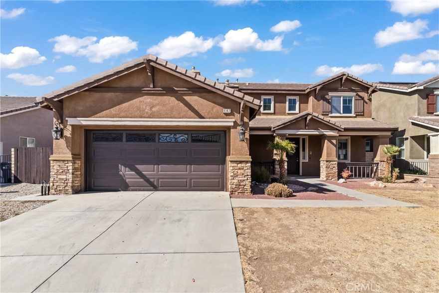 Welcome to this inviting two-story home in Quartz Hill featuring 5 bedrooms, 3 bathrooms, and a spacious loft. Offering 2,859 sq. ft. of living space, the open floorplan highlights soaring ceilings, recessed lighting, and laminate flooring throughout. The formal living and dining rooms connect to a well-designed kitchen with granite countertops, wood cabinetry, appliances, and a breakfast bar, opening to the family room with a cozy fireplace. The first floor includes a bedroom and full bath, while upstairs offers the loft, laundry room, and four bedrooms, including the primary suite with dual vanities, soaking tub and shower. The private backyard features a covered patio and side yard, perfect for relaxing or entertaining. Nestled on a quiet cul-de-sac, this home combines comfort, style, and a desirable location.