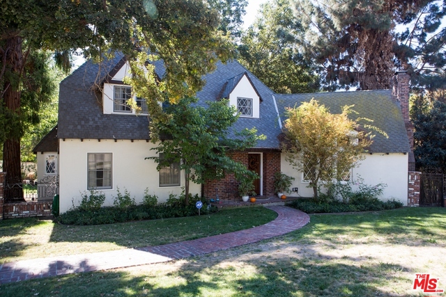Charming home designed and built by architect Vernon E. Barker. Become the third owner of this beautiful residence, situated elegantly on a spacious corner double lot in a quiet walkable pocket of town. This home was renovated throughout in 2010 by the original owners of record with permits from the city, fenced with an ornamental brick/iron fence in 2011, and still in great condition inside and out. Central AC/heat, claw-foot tub, wood floors on main level, wood steps/banister, over-sized wood-burning fireplace, original cathedral vaulted ceiling in the living room, cozy country kitchen with eating area and look-out windows to backyard, carpet in 3 of 4 bedrooms, tiled kitchen and bathrooms, casement windows, custom window coverings... Many fine features throughout! Third bonus level of home (below main level) is a legal basement level with laundry area, storage space, and garage with access to your backyard and driveway. Garage doors are original rolling carriage doors. Must See!