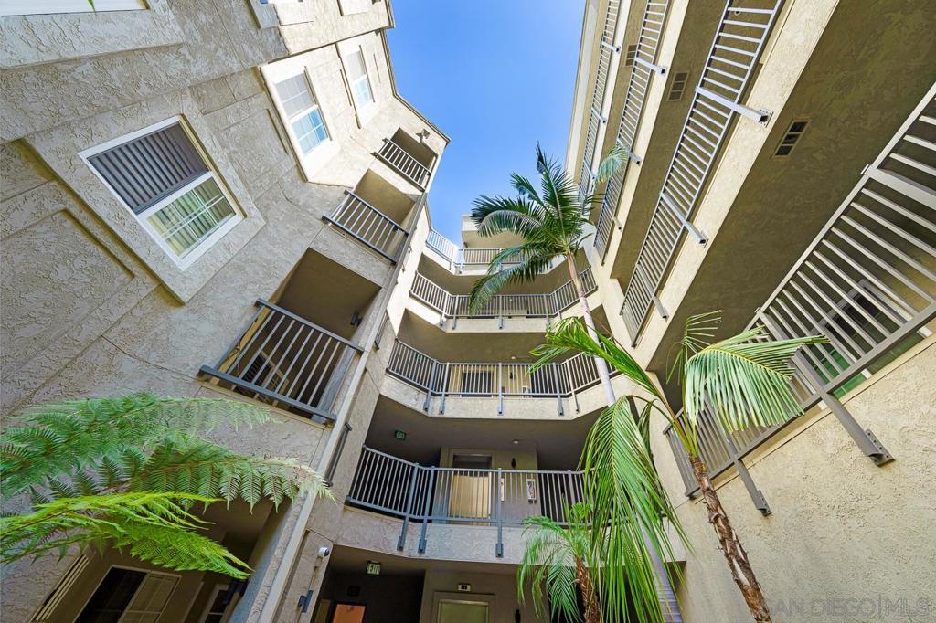 Priced aggressively to sell quickly. Price per S.F. is the best in North Park! This gorgeous condo is located in the highly desirable, upscale Coventry Woods complex in the heart of North Park. Enter through the beautiful Craftsman-like lobby door to the sophisticated and welcoming lobby. This “feels like a home” condo features great space with modern ceiling height, a gracious living room with soft, lit built-in shelving, a handsome fireplace with mantle, and perfectly set indirect lighting. The well-planned open kitchen features brand-new, gleaming stainless steel GE appliances. A side-by-side washer and dryer, also newer, are located in a full-size laundry room with storage cabinets. The wrap-around patio is accessed by sliders in the living and master bedrooms, and the view from the balcony is of lush, natural greenery as far as the eye can see. Just minutes away from Morley Field, Balboa Park, San Diego Zoo, Naval Hospital, Shops, Restaurants, and downtown San Diego. Be sure to check out the rooftop deck for lounging, entertaining, and BBQs. The unique property also includes two assigned garage parking spaces. Coventry Woods happens to be one of the nicest complexes in North Park!