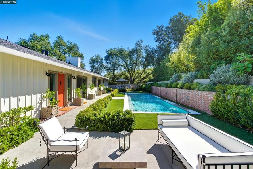 Welcome to 47 Charles Hill Circle, a gated Orinda estate that seamlessly blends timeless Mayhew architecture with modern luxury. Set on a sun-drenched property capturing views to Mt. Diablo, this fully remodeled gated estate offers 3 bedrooms and beautifully updated living spaces filled with natural light. The chef’s kitchen is a showpiece with Calacatta marble, Waterworks fixtures, a Shaws sink, custom cabinetry, and GE Monogram appliances. The expansive living and dining rooms feature white oak floors, oversized picture windows, and sliders that open to the resort-like grounds. A sparkling new pool with fountains and multiple patios creates effortless indoor-outdoor living. The primary suite is a sanctuary with a marble spa bath, steam shower, soaking tub, and custom dressing room (old 4th bedroom that could be converted back) with automated blinds. Additional highlights include new Andersen windows, updated systems, EV charger, security, and landscaped gardens with greenhouse and raised beds. Moments from both Orinda and Lafayette town centers, BART, Hwy 24, and top-rated K–12 schools, this estate offers the ultimate Lamorinda lifestyle. Sophisticated and Fabulous! Welcome Home!
