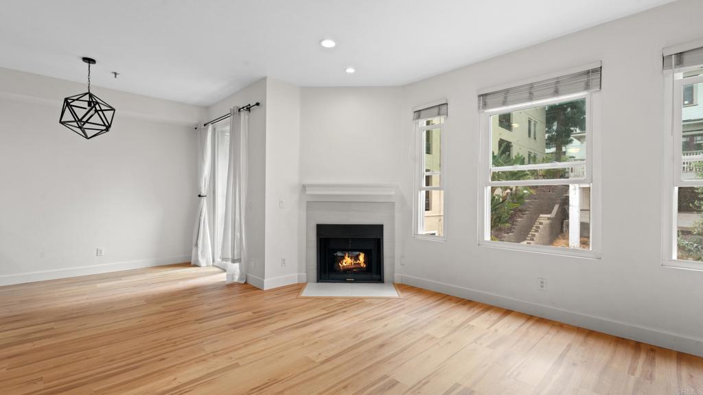 Discover comfortable living in this updated 1-bedroom, 1-bath home at Villa Portofino in Bankers Hill. Enjoy brand new floors, 9' ceilings, a cozy fireplace, and large windows that open to a private balcony with direct access to the complex’s pool, spa, gym, and barbecue area. The kitchen features sleek quartz countertops, updated cabinets, and recessed lighting. You’ll appreciate the in-unit washer/dryer and rare two dedicated parking spaces. The spacious bedroom offers a large closet, and the bathroom includes a fully tiled shower and jetted tub. Situated minutes from Balboa Park, Little Italy, downtown, and the airport, this condo puts the best of San Diego at your doorstep. Contact us to schedule a viewing and make it yours!