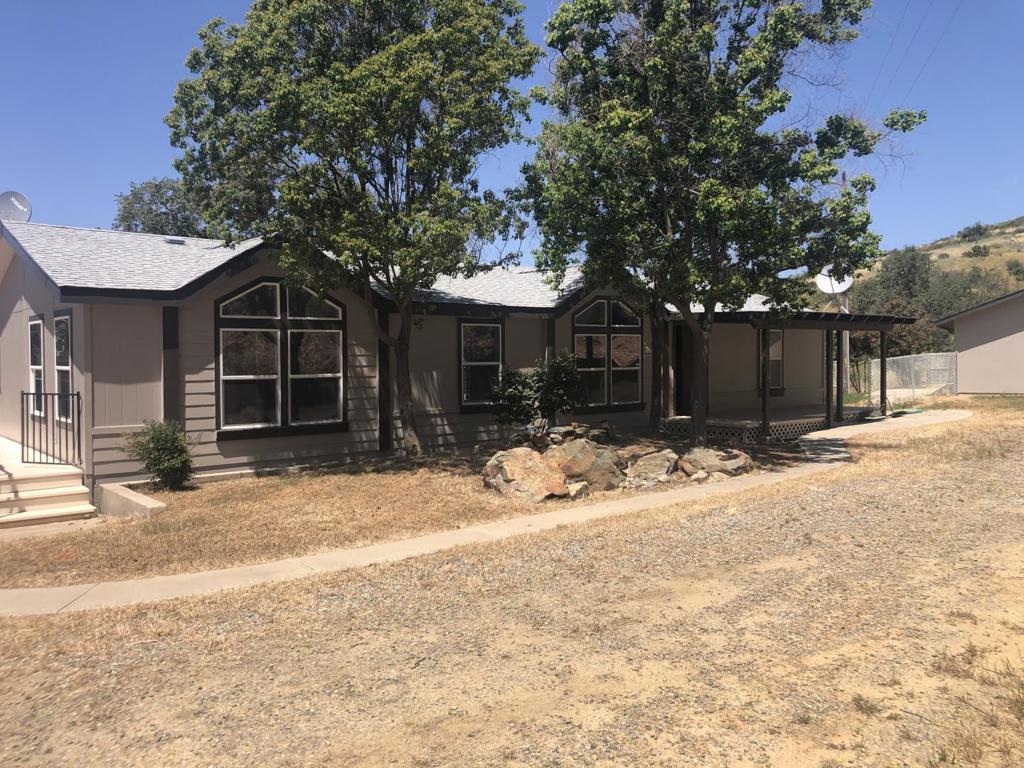Price reduced Golden opportunity! 44.6 acres with 3bed 2bath 1449SQFT Recently updated home with new appliances that also features a separate 1000 SQFT apartment with a loft. It has A 1700sqft garage with drive through rollup doors and large covered building garage attached two wells and two year round creeks two separate electric meters; a covered BBQ area with basement/root cellar And your own private gold mine on site (see sample quarts pic) This property is bordered by BLM land. This property also has deeded private access to a lakeside beach on lake McClure shared with 11 local property owners