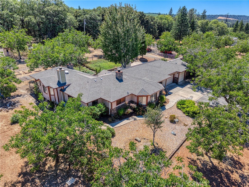 CUSTOM BUILT HOME - FIRST TIME EVER ON THE MARKET!
Tucked away in the scenic and highly desirable Red Hills of Kelseyville, this beautifully maintained ranch-style farmhouse offers the perfect blend of country charm and modern convenience. The main home features 3 spacious bedrooms, 2bathrooms, 2,033 sqft. , with an open-concept layout connecting the kitchen to the living room, complete with a large bar top that’s perfect for entertaining.
A separate 2 bedroom, 1 bathroom , 800 sqft. ADU provides excellent space for guests, rental income, or multigenerational living.
Sitting on 4+ acres and surrounded by mature walnut trees and rolling vineyards, the property boasts an enclosed shop with 10k lift and air compressor, RV-sized carport, horse shelter, 50ft light weight panel round pen, 80x160 heavy weight panel arena, hay barn, sheds and more! Property also includes producing fruit trees—apple, pear, and walnut. An additional office space with its own private entrance makes working from home easy and private.
Take in the breathtaking views of nearby Boatique Winery and enjoy the peaceful setting with limited neighbors, approx. 10 minutes to downtown Kelseyville and less than 5min to HWY 29 for easy commuting towards Napa or Mendocino County. The low-maintenance, fenced backyard is ideal for pets, kids, or simply enjoying the quiet.
Added bonuses include owned solar, a newer roof, a newer well, and energy-efficient mini-splits for modern, customizable heating and cooling.
Whether you’re looking for a full-time residence, vacation getaway, or income-producing property, this one checks every box. Country living with convenience, privacy, and stunning natural beauty!