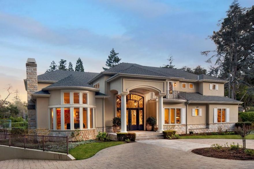 This classic estate property, on just over 1.5 gated acres, exudes timeless elegance in a beautiful setting with redwood groves, vast stretches of lawn and terraces, plus a pool, spa and sport court.  Marble and oak floors, lofty ceilings, and intricate millwork define the main living areas, which include traditional formal venues, a personal chefs kitchen plus the main kitchen, a large open family room, media/play room, and an executive office. Personal accommodations include 5 bedrooms, each with en suite bath. There is a spacious multi-room primary suite as well as a junior suite that is ideal for guests or extended family. The lower level (not included in the 7,663 SF is approximately an additional 3,850 SF) includes a vast garage with parking for approximately 12 cars a haven for collectors, multiple storage rooms, a full bath, and customized wine cellar. Outside, complete privacy awaits with cabana for dining and lounging, an outdoor kitchen, plus a sport court tucked away at the rear of the property.   Sought-after central Atherton address minutes to downtown Menlo Park.  Buyer to confirm square footages.