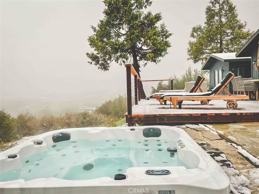 Panoramic Sierra Views & Modern Mountain Comfort!

Amazing views and privacy highlight this recently renovated mountain home, ideally located just minutes from Oakhurst, Bass Lake, and Yosemite’s South Gate. Perched on a scenic ridge, the property captures nearly full views of the Sierra Nevada and surrounding foothills, offering a rare combination of seclusion and accessibility.

Inside, the spacious open-concept floor plan features a bright living area with large windows that frame the sweeping mountain vistas. The updated kitchen includes modern appliances, ample counter space, and custom cabinetry—perfect for everyday living or hosting gatherings.

The home offers three comfortable bedrooms and two full bathrooms, including a private primary suite with its own bath and soaking tub. Central heating and air conditioning ensure year-round comfort, while the separate laundry area adds everyday convenience.

Step outside to enjoy a peaceful outdoor living space complete with a private patio, hot tub, BBQ area, and plenty of room for entertaining. Whether relaxing under the stars or taking in the sunrise over the mountains, this property offers a truly serene lifestyle setting.