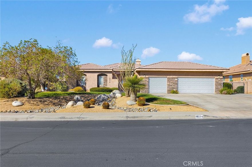 Welcome to 19274 Kanbridge St located in one of the most exclusive communities in the High Desert. Stonebrook Estates. As you walk past the gated courtyard you are greeted with an inviting living room and 12-foot ceilings. A bar nook completes this space perfect for entertaining family and friends. This home features a bright, open floor plan with a beautifully appointed kitchen showcasing granite countertops and a spacious breakfast nook. A formal dining room offers the ideal setting for family dinners or hosting special occasions. The primary bedroom is thoughtfully positioned for privacy, separate from the other bedrooms. It features a luxurious ensuite bath with dual vanities, a jetted tub, a walk-in shower and dual closets - one of which is a walk-in. Enjoy the warmth and charm of not one, but three fireplaces, located in the living room, breakfast nook and primary bedroom. You have an indoor laundry room with storage cabinets. A three-car garage to store your toys. RV parking potential. Outside, both the front and backyard feature low maintenance desert landscaping, providing beauty and ease of care. Home is equipped with solar panels for energy efficiency. Who needs a high maintenance pool when you are a house away from it? Stonebrook Estates offers private security patrol, tennis and pickleball courts, a community pool, clubhouse and is only minutes away from shopping and dining.