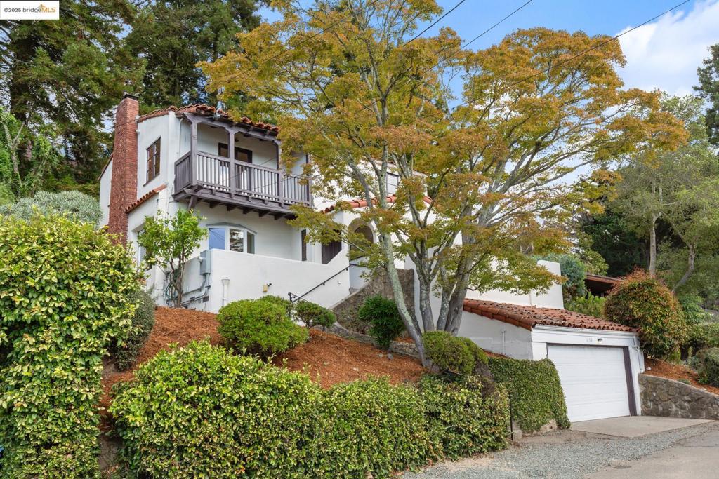 Welcome to this lovingly well maintained home in the heart of the Berkeley Hills, offering 1,734 sq. ft. of living space on a 5,200 sq. ft. lot (per public records). From the spacious sitting room, outdoor patios, and primary bedroom, you’ll enjoy stunning views of San Francisco, the Bay and The Golden Gate Bridge. The galley kitchen flows into a bright, sun-filled dining room that opens directly onto one of two front patios, creating an effortless indoor-outdoor connection. Newly refinished hardwood floors run throughout, adding warmth and charm to every space. Upstairs, three bedrooms include ample closet space; two of the bedrooms have balconies—one with west-facing views and one east-facing the back yard. A one-car garage provides direct access from the street, and an additional parking space sits conveniently at the front entrance steps. The kitchen and bathrooms are ready for a new owner’s vision, offering the opportunity to add modern updates while preserving the home’s character. Come see why this Berkeley Hills gem offers the perfect blend of comfort, potential, and world-class views. (Bath Count differs from public record.)
