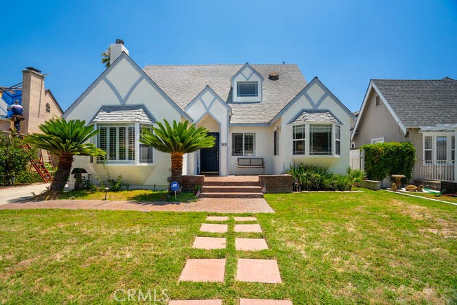 Step into timeless charm reimagined for modern living in this beautifully updated 4-bedroom plus office and 3-bathroom home, located in Glendale’s coveted Rossmoyne neighborhood. Originally built in 1924 and thoughtfully transformed in 2000, this 2,518 sq ft residence blends classic Tudor-inspired architecture with contemporary comforts. The south facing home has a manicured lawn with automatic sprinklers and a recently painted exterior. As you walk up the brick steps and enter the home the foyer opens up to the large living room with gas operated fireplace. There is a private office to the right of the entry perfect for the remote worker or could be used as a nanny’s quarters. Just beyond the staircase is the dining room, den and kitchen that opens out to the lovely backyard. Inside, rich wood floors flow throughout a spacious, light-filled layout. The main level features an inviting living area perfect for entertaining, a lower level bedroom and private office while the upper level includes three carpeted bedrooms including a serene primary suite with a private en suite bathroom and balcony looking out towards the skyline. The Laundry closet is located on the second floor for convenience. Each of the bedrooms offer generous space for family and friends. The home has central Air and Heating and dual paned windows.
Outside, enjoy sunny Southern California days in your private backyard oasis, complete with a covered patio for outdoor lounging and BBQs, a sparkling pool, an inviting spa and a large detached garage that can be converted to an ADU or pool cabana.
Located just minutes from Nibley Park and some of Glendale’s best dining and shopping, including Whole Foods, Erewhon (Coming Soon), Fish King, Pardis, We’re Pouring, and Skaf’s Lebanese eatery. This home also offers convenient access to downtown Glendale, the Americana at Brand, the 134, 2, and 5 freeways, and is close to local schools. Don’t miss this rare opportunity to own a beautifully reimagined classic in one of Glendale’s most desirable neighborhoods.