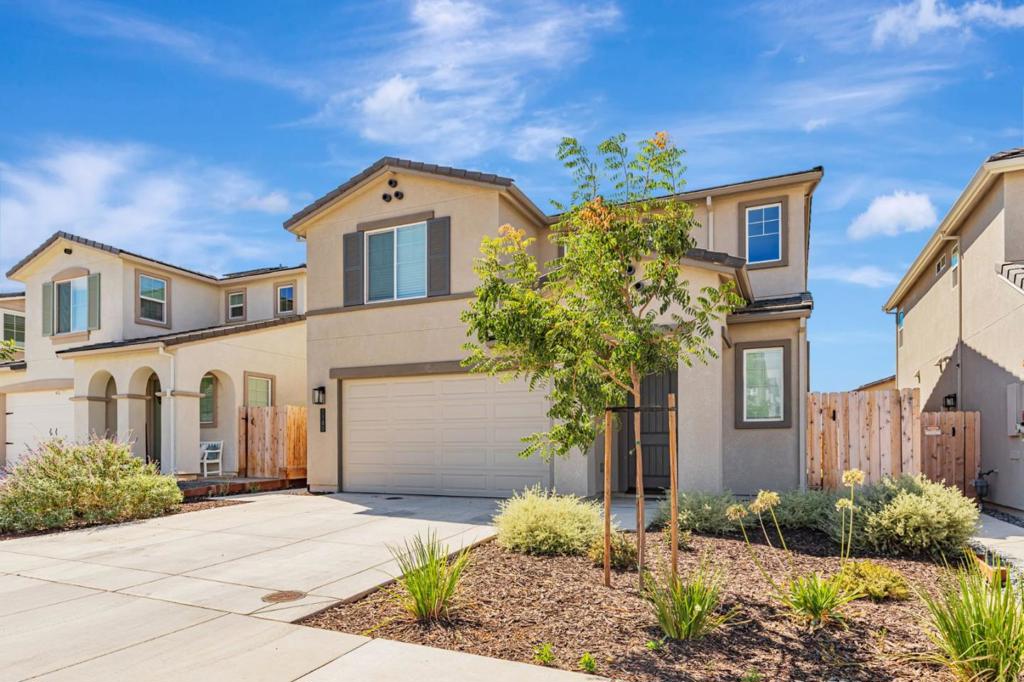 Why wait for new construction? Move right in to this beautiful Santana Ranch home located in the delightful city of Hollister! The Ventura floorplan is open with a spacious kitchen and family room which is perfect for those who enjoy entertaining and large family gatherings. The kitchen is a culinary delight featuring ample shaker style cabinets, granite countertops, large island with space for dining and a separate pantry for extra storage. The first floor has beautiful luxury vinyl flooring throughout with carpet and tile upstairs. Additional features include recessed lighting, ceiling fan and window coverings. The primary suite has an oversized walk-in closet with double sinks and walk-in shower in the bathroom. Bedrooms two and three are large with an oversized walk-in closet in the second bedroom. This is an energy efficient home with Energy Star appliances and HVAC, tankless water heater and low maintenance landscaping. A neighborhood park is within waking distance plus restaurants and shopping are a short drive away.