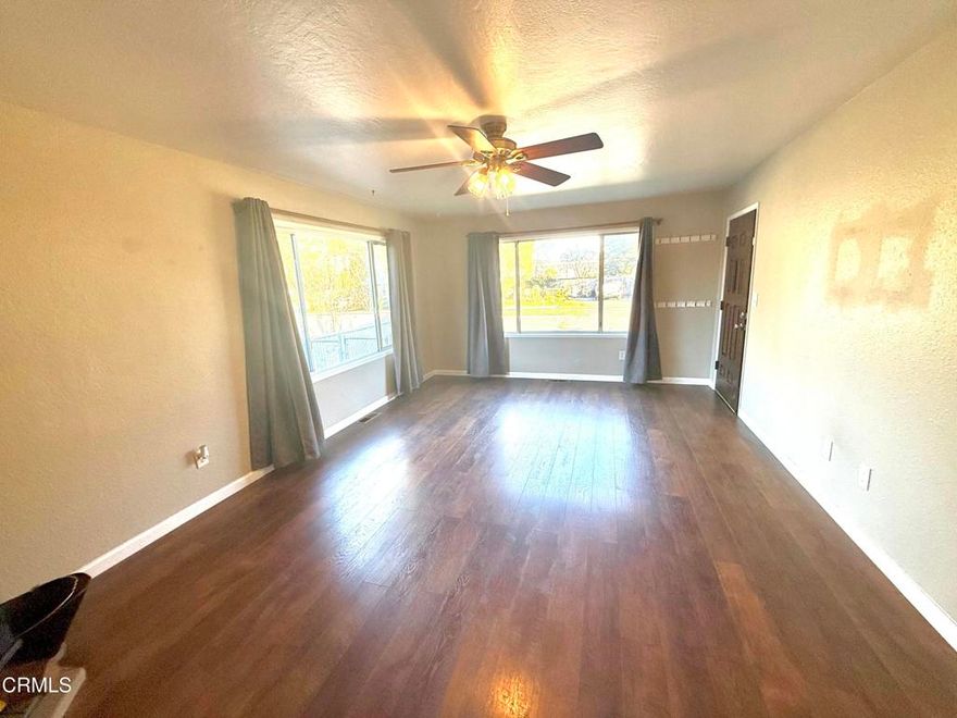 Charming Mid-Century Gem on an Expansive LotDiscover this beautifully maintained 2-bedroom, 1-bath home, offering timeless character and exceptional outdoor space. Set on a generous lot, the property features a stunning rose garden, established garden beds, and a spacious backyard ideal for entertaining, relaxing, or future expansion.Inside, you'll find a bright and inviting living room with abundant windows that fill the space with natural light. A cozy fireplace creates the perfect focal point for gatherings and quiet evenings alike. The dining area is ideally positioned to enjoy both the sunlight and views of the garden where there is an apple and pear tree.The large mid-century kitchen offers an impressive amount of counter space and cabinetrya'rich with vintage charm yet highly functional for everyday cooking and hosting. Both bedrooms are comfortably sized, with the full bathroom conveniently updated and accessible.A two-car garage provides ample parking, storage, or workshop potential, adding even more value to this exceptional property.With its combination of indoor comfort, mid-century character, and expansive outdoor living with solar, this home is a rare opportunity that blends charm, warmth, and space in one special package.