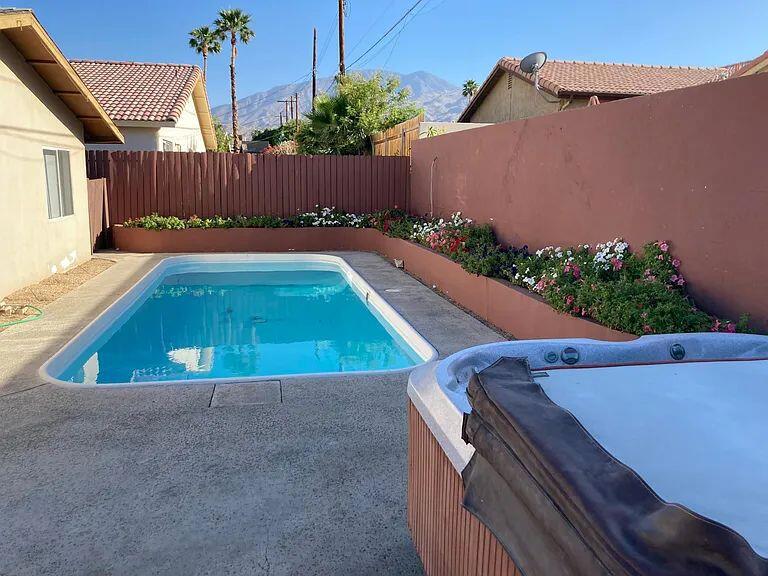 Welcome to this charming pool home in La Quinta Cove, where breathtaking mountain views meet modern comfort! This beautifully maintained property features brand new flooring throughout, enhancing its appeal. Perfect for investors, this home comes with a reliable tenant already in place, providing steady rental income until February. Enjoy outdoor living at its finest with a private pool, ideal for soaking up the sun against the stunning backdrop of the mountains. The spacious layout offers ample room for relaxation and entertainment, making it a delightful retreat for both residents and guests. Don't miss this opportunity to own a slice of paradise in one of La Quinta's most sought-after neighborhoods. Schedule a showing today and experience the beauty and investment potential this home has to offer! Get pre-approved with Jarrod Leitch at Franklin Loan Center www.franklinlc.com/jleitch Free appraisal credit upon closing!!!