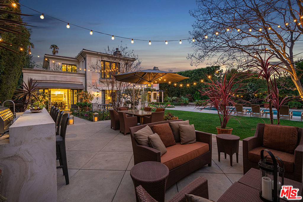 Stunning Mediterranean Toluca Lake Celebrity Estate on .75 acres. Private romantic villa masterfully designed by architect Kevin Clark, recently updated. Grace and opulence reign. Old World craftsmanship incl. elegant crown molding, mantels & custom built-ins. Beautiful marble & new hardwood floors. Enjoy living/screening room, bright dining area & bar. New gourmet kitchen & family room are wonderful spaces to relax w/family & friends. New appliances & fixtures. L-shaped island w/snack bar, prep sink & wine fridge. Spacious family bedrooms & new baths. Sumptuous master offers lux en suite, soaking tub, new steam shower, underfloor heating. New gym, 2 offices, music room & maids'. New landscape, privacy trees/hedges, lawns, fencing & pool house. Upgraded pool w/glass tile & spa. Lovely new patio w/fireplace, outdoor audio/TV, new BBQ grill w/sink, fridge, cold drawer. New Control4 for TV, audio, drapes, lighting, security/cameras/new gates. Remodeled garages (4 car). 2 br guest house.