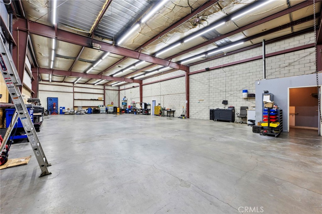 A rare opportunity for business owners and investors—this commercial warehouse offering spans 5,944 sq. ft. across two separate parcels, sold together. Please note: pricing is listed per parcel and is not combined. The property features a fully fenced storage yard with ample space for semi-trucks, work vehicles, and heavy equipment. Ideal for logistics, fleet operations, construction, or auto-related businesses, it offers versatile warehouse space that can be adapted for service bays, equipment storage, or inventory management. The secure yard is designed for high-volume operations, ensuring safe and efficient access. Located in San Bernardino with close proximity to major freeways and key transportation corridors, this asset sits in one of Southern California’s fastest-growing industrial hub!