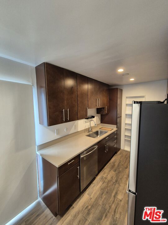 Beautifully Updated 1-Bedroom Corner Unit with Wraparound Balcony. Prime Culver City Location. Welcome to this light-filled, stylishly updated corner unit just steps from vibrant Downtown Culver City, yet tucked away on a quiet, tree-lined street. This spacious 1-bedroom residence features only one shared wall and large windows in every room, offering exceptional natural light and a sense of privacy. Enjoy indoor-outdoor living with a rare wraparound balcony. The newly updated bathroom includes a sleek shower/tub combo with modern finishes. The updated kitchen boasts stainless steel appliances, including a refrigerator, dishwasher, microwave, and electric stove. Two tandem parking spaces in a covered, gated garage. Custom cabinetry and ample storage, including a large walk-in closet. Wall-mounted A/C unit and ceiling fan for year-round comfort. Secure building with lobby entry, elevator access, and a peaceful courtyard. Whether you're a first-time buyer or looking for a turnkey investment in a prime location, this move-in ready unit offers comfort, convenience, and classic Westside charm.