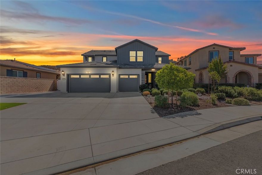 Welcome to this extraordinary Menifee estate, privately nestled at the end of a cul-de-sac with no rear neighbors and stunning hillside views. Showcasing beautiful designer upgrades, this one-of-a-kind property features a spacious 4,134 sq. ft. layout on a beautifully landscaped 10,000+ sq. ft. lot — complete with a fully equipped attached ADU offering a private entrance. Perfect for multigenerational living, older children or generating rental income. This ADU has everything...bedroom, bathroom, office attached to bedroom, living room, laundry room, kitchen with quartz counters, stainless steel appliances, gorgoues backsplash, lots of storage, plantation shutters and its own dining area. Going into the main home you are met with custom finishes that are not found in most homes of this caliber...even the front screen door is unbreakable for added security. This home boasting quartz countertops, a large island with bar seating, a five-burner built-in gas cooktop, double oven, a walk-in pantry, and stylish light fixtures. The open-concept design flows seamlessly into the expansive great room, ideal for entertaining or relaxed everyday living. Upstairs, the generous primary suite provides a huge serene retreat with ample space to unwind and personalize. Each additional bedroom offers comfort and style, while the home’s thoughtful layout ensures privacy and functionality for every member of the household. Step outside to your private resort-style oasis. The backyard is professionally designed with custom hardscape, landscaping, decorative retaining walls, smart irrigation, and elegant outdoor lighting. Enjoy the covered patio with large and beautiful ceiling fans, a large Cal Spa jacuzzi, and a separate Cal Spa hydrotherapy lap and excercise pool — the perfect setting for year-round relaxation and gatherings. Take the stairs up in the back yard for incredible views as you sit out at night and enjoy those star filled evenings. Energy efficiency abounds with an owned solar system and a  leased 11.46 KW solar system and three backup battery packs, offering peace of mind and reduced utility costs. Centrally located near all necessary shopping and dining, and just a short drive to Temecula Wine Country, Old Town Temecula, and Old Town Murrieta — this premium dual-unit estate offers the perfect balance of luxury, convenience, and lifestyle. Close to award winning schools and 15/215 freeways. Schedule your showing today!