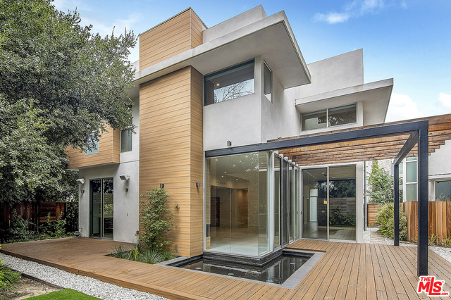 Recently built Modern Contemporary located on a peaceful cul-de-sac in the heart of Encino. This Architectural two story 4 bed, 5 bath offers approx. 4036sf of luxury living w/ open floor plan, functional spaces & high end finishes - the best of So Cal living. Chef's kitchen with custom cabinetry, stainless appliances & center island. Great room with soaring ceilings and fireplace. Large en-suite bedrooms, including master suite with a must see it to believe it walk in custom closet, as well as a sophisticated master bath with double sinks and vanity. Upstairs is rounded out by multi-purpose flex space with open loft like feel and wet bar. Indoor/outdoor living with oversized patio accessible from entire first floor, yard and water feature. Beautiful lush landscaping and stunning exterior Brazilian hardwood. Minutes to restaurants, shops and parks.