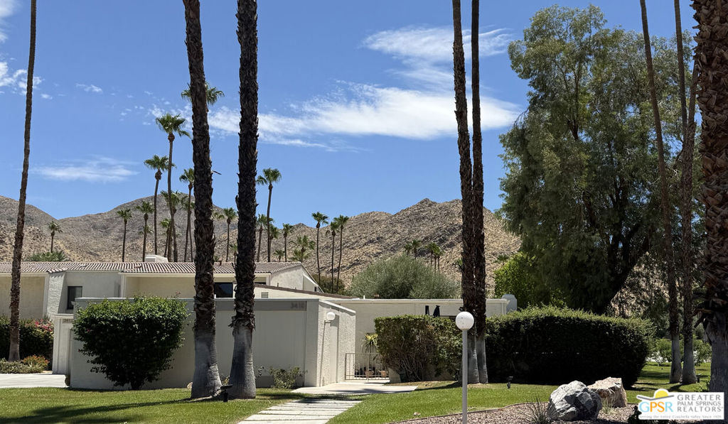 Welcome to Andreas Hills, an enclave of million dollar homes with million dollar views and underground utilities. This quiet area of South Palm Springs, close to the Indian Canyons is known for its hiking trails and scenic vistas. This 2 bedroom 2 bath condo is 1,882 Square feet with a double car garage all on one level with green belt surrounding the unit. This condo has been upgraded with real walnut wood flooring throughout. The gated entry and front patio area gives privacy and feels more like a single family home.