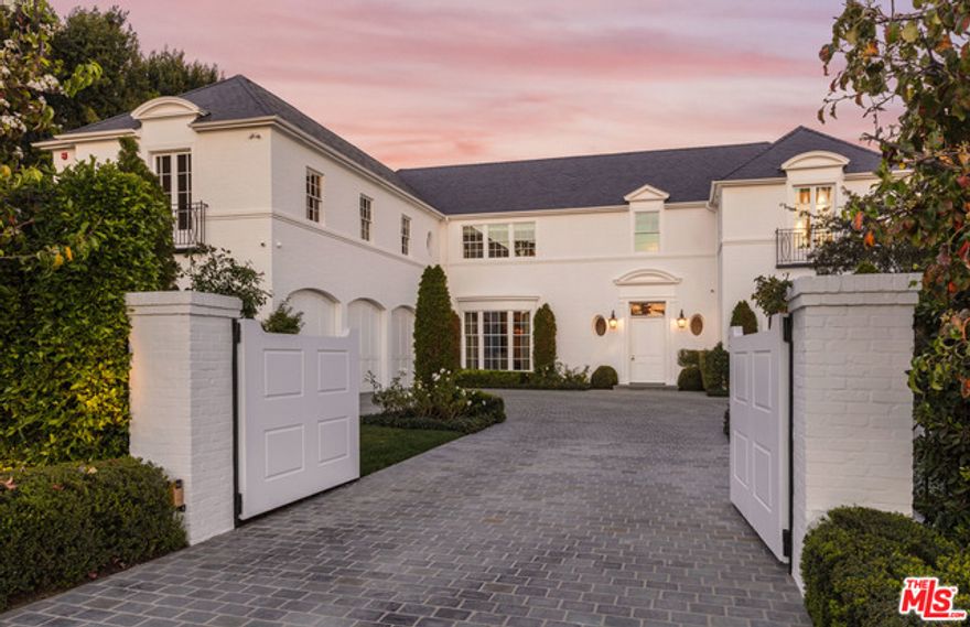 An award winning traditional estate in prime Beverly Hills. Completed in 2015 and designed by Thomas Proctor to blend 1930's period details with todays modern living. Featuring soaring 11-foot ceilings, a walnut paneled library/bar, formal living room, dining room and a sun filled kitchen/family room. 8 bedrooms, 12 bathrooms with an upstairs family/play room. The entertainment level offers a state of the art screening room, sit down wine cellar and gym. Outside you will find beautifully landscaped grounds with the pool/spa, patio space for dining, covered terrace with a fireplace, outdoor kitchen/bbq and a spacious guest house/pool cabana.