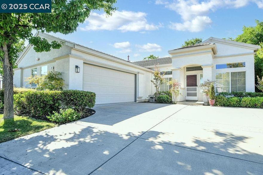Welcome to this charming 55+ Summerset 1 residence, where comfort meets convenience in a low-maintenance setting. Situated on a desirable corner lot, the home invites you in with a charming covered entrance. Inside, you're greeted by high ceilings that flood the space with natural light, creating a warm and inviting atmosphere. The open-concept layout is perfect for both relaxation and entertaining, featuring two spacious living areas, a cozy fireplace, and a formal dining area. The eat-in kitchen is a chef's delight, complete with a breakfast bar and freshly painted cabinets. Both spacious bedrooms offer the luxury of walk-in closets, while the primary bathroom is equipped with double sinks for added convenience. Additional highlights of this home include an indoor laundry room with a sink and storage cabinets, as well as a secure, attached two-car garage. Step outside to enjoy a low-maintenance yard and patio, perfect for unwinding or hosting gatherings. This lovely gated community offers a community pool/spa, gym, tennis courts, bocce ball courts, and various activity clubs. Close to John Muir, Kaiser, CVS, and Safeway. Don't miss your chance to own this lovely home and lifestyle.