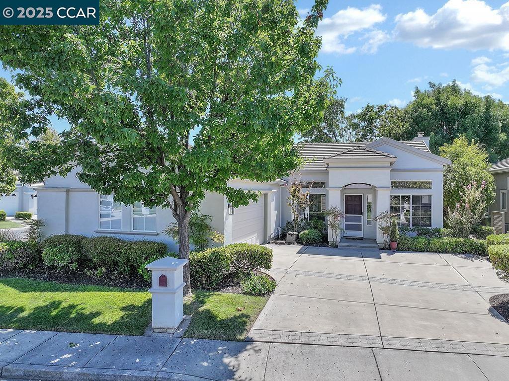 Welcome to this charming 55+ Summerset 1 residence, where comfort meets convenience in a low-maintenance setting. Situated on a desirable corner lot, the home invites you in with a charming covered entrance. Inside, you're greeted by high ceilings that flood the space with natural light, creating a warm and inviting atmosphere. The open-concept layout is perfect for both relaxation and entertaining, featuring two spacious living areas, a cozy fireplace, and a formal dining area. The eat-in kitchen is a chef's delight, complete with a breakfast bar and freshly painted cabinets. Both spacious bedrooms offer the luxury of walk-in closets, while the primary bathroom is equipped with double sinks for added convenience. Additional highlights of this home include an indoor laundry room with a sink and storage cabinets, as well as a secure, attached two-car garage. Step outside to enjoy a low-maintenance yard and patio, perfect for unwinding or hosting gatherings. This lovely gated community offers a community pool/spa, gym, tennis courts, bocce ball courts, and various activity clubs. Close to John Muir, Kaiser, CVS, and Safeway. Don't miss your chance to own this lovely home and lifestyle.