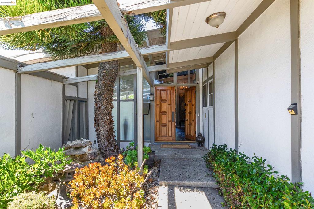 Step into a true oasis with this stunning Eichler-inspired home, perfectly positioned in the coveted Fairview Neighborhood of the Hayward Hills. With 4 spacious bedrooms and 3 bathrooms, this expansive 2341 square-foot residence sits on a private lot over 10,000 square feet. The thoughtfully designed single-story layout ensures both comfort and functionality, with a separate 4th bedroom wing featuring its own kitchen and living area—ideal for a primary suite, guest quarters, or au pair space. This home offers a blank canvas for your personal touch, waiting for your vision and care to restore it to its original luster. The possibilities are endless as you bring this beauty back to life, tailored to your style and needs. Your backyard retreat awaits—designed for resort-style living, complete with an in-ground pool, sweeping views, and a versatile outbuilding to suit any purpose you desire. Don’t miss the chance to own this unique, one-of-a-kind property. It’s a rare find that’s ready to become your dream home.