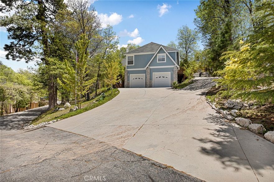WOW, WOW, WOW!!!  If You Are Looking for a Home that is Turnkey, Knockout GORGEOUS, Ready to Just Enjoy with Plenty of Entertaining Space, THIS IS THE ONE!!!!  This Incredible Home in the Highly Sought After North Shore Area Can Come with a Dock at Tavern Bay & an Almost New Pontoon Boat (for Extra $$) to Complete Your Full Lake Home Package!  Walk Along Beautiful North Shore Road to Your Boat Slip at Everyone's Favorite Beach Club, Tavern Bay!  Enjoy the Day Swimming & Laying on the Beach!  Go for a Boat Ride to the Village!  Enjoy the Art & Wine Festival Here too!  AMAZING LOCATION!!!!  And the House is To Die For!!!   YOU WILL FALL IN LOVE with the Amazing Outdoor Areas on this HUGE, OVER 1/2 ACRE LOT with Waterfall, Gorgeous Colorful Landscaping Throughout & Multiple Sitting Areas to Enjoy the Tranquility!  There is Even an Oversized Dog Run Area, Horseshoe Pit and a Playground! Upon Entering the Home, it Truly Takes Your Breaths Away! There is So Much Natural Light Flooding in and the Walls of Windows, Soaring Ceilings & Hardwood Floors are Just Stunning!  The Open Floor Plan is Perfect for Entertaining with its Oversized Gourmet Kitchen, Eat-in Kitchen Area and Large Dining Room that Opens to the Side Deck.  Open the Doors to Hear the Cascading Sounds of the Waterfall & the Birds Chirping!  The Main Level Has the Primary Suite with Deck that Leads to the Hot Tub and a Second En Suite Bedroom with Nursery! Downstairs is the Den/Game Room with 1/2 Bath and Two More En Suite Bedrooms, One Being a Bunk Room for the Kiddos!  All En Suite Bathrooms Have Heated Floors too!! This Home Has Soooo Much Space for Parking - Bring Your RV too! Parking for 15 PLUS the Garage!  GOLF CART Included!  It Even Has a Whole House Generator! Best of All, this Newer Home Built in 2001 Has Been So Lovingly Maintained!  Schedule Your Tour Today to See this Absolutely STUNNING Home!!