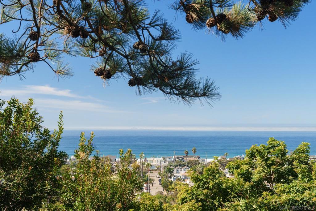 Perched along one of the most iconic streets in Olde Del Mar, 2165 Balboa Avenue is a rare legacy property offering nearly 360-degree unobstructed views that span the Pacific Ocean, San Dieguito Lagoon, and surrounding mountains. This is not just a home—it’s a generational opportunity to create a one-of-a-kind coastal estate in a location that’s as timeless as it is irreplaceable. With only two families having owned the property since its original construction in 1950, 2165 Balboa carries a rich history and the promise of a new chapter. Floor-to-ceiling glass doors frame the best view in all of Del Mar, seamlessly connecting indoor and outdoor living. From sunrise over the hills to sunset over the Pacific—and even views of the races at Del Mar Racetrack—this is a vantage point few will ever experience. The existing residence offers three bedrooms, two baths, and a primary suite retreat with ocean and lagoon views, a cedar walk-in closet, and a private patio. The home’s open layout, natural light, and expansive wraparound deck make it the perfect setting for both tranquil mornings and elegant entertaining. But it’s the future that sets this property apart. With conceptual plans by award-winning designer Tyler Buffett, thoughtfully created in collaboration with Del Mar’s planning departments, this site is primed for a fully custom architectural masterpiece. The vision pairs dramatic coastal elegance with serene privacy, maximizing every angle of this irreplaceable view corridor. Steps from the sand yet elevated in privacy and presence, See supplement... Steps from the sand yet elevated in privacy and presence, 2165 Balboa Avenue is a once-in-a-lifetime chance to secure one of Del Mar’s most exceptional view lots—and craft a legacy home that will endure for generations.