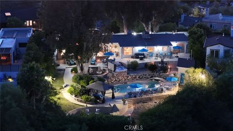 Photo of 5038 Cerrillos Drive, Woodland Hills, CA 91364 (MLS # SR26073178)