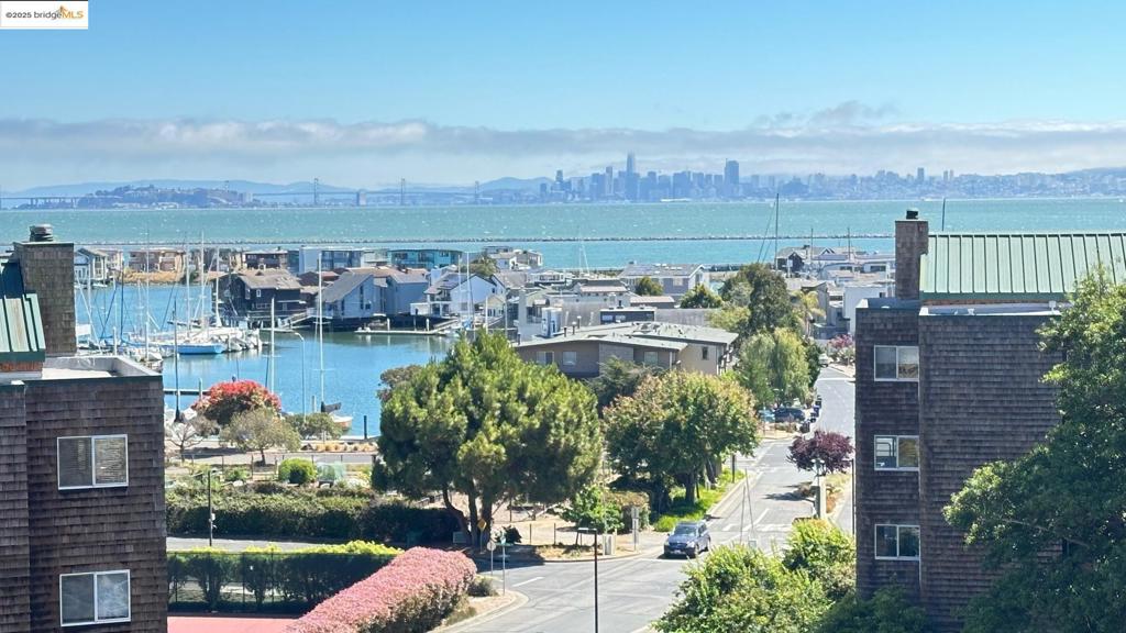 One of only a few units with THREE different outside decks in Brickyard Landing. Enjoy southwest exposure from deck #1 with gorgeous bayview and views of SF, Treasure Island, Bay Bridg. Deck #2 facing east, offering a perfect spot for morning sunrises and watching deers walking around. Deck #3 faces northest and offers a spcious area, perfect for entertaining, lunch and twilight dinner. French doors that graciously open to bold, glass-enclosed solarium with terra cotta tiled flooring. Distinctive gourmet kitchen that expand into cozy breakfast nooks. Wood-burning fireplace with tiled surrounds. New paint throughout. Being the end unit, it offers privacy with only one common wall. Only first level units are able to use same flooring throughout the entire unit. Such as wood or tile flooring in every room. Easy access to outside through the side door that steps away from the unit. Owner has been living in the same unit for 30 year. They updated the kitchen counter top as corian. Total five room including the solarium. Weelchair accessable. Side by side 2 parkings with storages where is one level down. Receation facilities including competition-quality tennis court, exclusive swimming pool and spa complex, a parcourse, saunna and fully equipped exercise. 30-minutes ferry ride to SF.