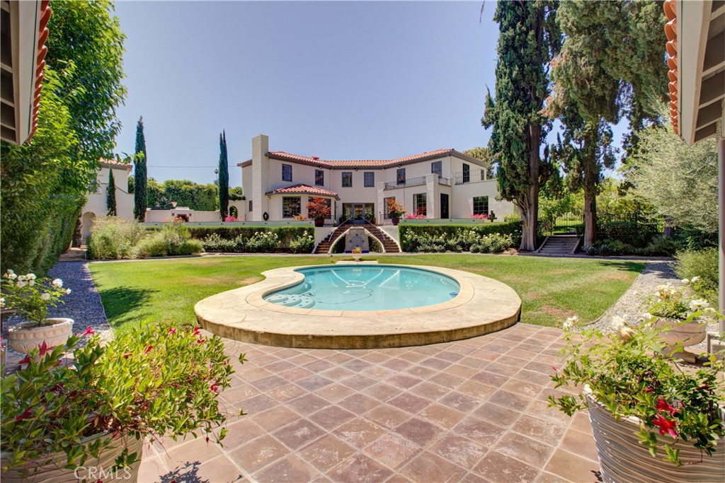 The price reduction just made this the deal of the decade. Known locally as the Lion House, this early 1910 Spanish Revival is one of the finest examples in California. Meticulously restored to its former glory with modern designer touches inside make this home one you won't want to miss. The magic begins in the gourmet kitchen boasting quartzite counters, recessed panel cabinets, Wolf range with a custom wood trimmed vent hood and Walker Zanger tile backsplash, a Sub-Zero refrigerator & dishwasher, enormous center island and large windows that let in so much natural light you'll think you're outdoors. Imported Spanish tile, original oak floors, laundry chutes from the upstairs ensuite bedrooms that end conveniently in the laundry room off the kitchen, new water saving fixtures and energy saving HVAC are just a few of the improvements that were 7 months in the making of this masterpiece. Outside you'll find a 1,300 square foot tile deck overlooking the backyard fireplace, pool and cabana, an 11 foot wrought iron automatic driveway gate and 3 matching wrought iron screen doors that let the breeze in. Above the carriage house that is easily converted to a garage you'll find a guest room and full bath. As beautiful as this home looks in photographs, the only way to truly experience the grandeur and attention to detail is to tour it. Once you have, I promise you will compare all others to The Lion House. ***This property qualifies for the Mills Act potentially reducing your annual property tax significantly. See supplement in MLS***