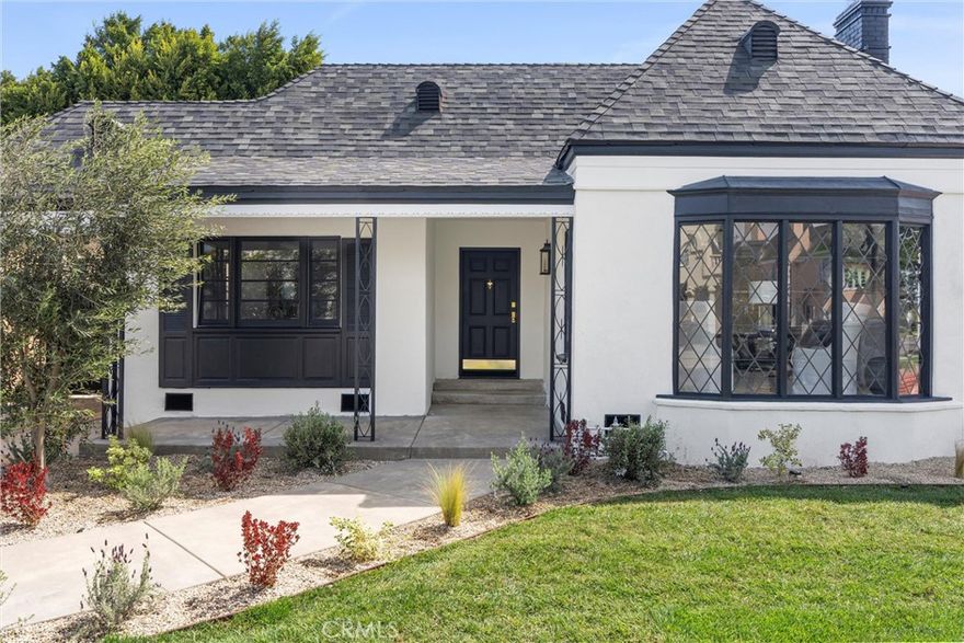 Welcome to 158 S Formosa Avenue, a rare reimagined traditional home nestled within a tranquil tree-lined street in the highly desirable Miracle Mile North Historic Preservation neighborhood. A Beautiful exterior color palette and succulent landscaping greet you upon arrival. Step inside and be captivated by the warm attention to detail, restoration, and creation of era style elements. The thoughtfully designed open-concept floor plan features a large gourmet kitchen perfect for culinary enthusiasts, complete with top-of-the-line custom matching appliances, quartz counters, white oak cabinetry, large Apron sinks, floating shelves and designer light fixtures. All overlooking the tranquil dining area. Your beautiful re-inspired living room features a stand out quartz fire place, custom crown molding, a historic timeless front bow window with leaded glass and French oak floors throughout. Parallel to the living room is your first bedroom, this could be converted very simply by the contractor into a den or your own private dining area if preferred. The large primary bedroom & bathroom features a double reeded vanity, standalone tub, walk in glass shower, large format designer tile, walk in closet, separate smaller closet and French doors leading out to a large wrap around deck. The other 3 bedrooms have ample space, closets and one of the bedrooms has french doors also leading out to the deck. The other two bathrooms have a mixture of marble vanities. Delta shower finishes, herringbone porcelain floors and brass hardware. The ADU has its own kitchenette, bathroom with walk in shower and hardwood floors, perfect for a at home office, studio or in-law suite. The ADU also features it's own address, gas & electric meter and tankless water heater. The grounds feature an enclosed new wood & iron gate, drip system, lush olive trees, a new large wooden deck perfect for hosting outdoor gatherings for al-fresco dining and entertaining. All new wooden privacy fencing, mature plants & trees, gravel and concrete. Upgrades include foundation, roof, furnace, plumbing, electrical, tankless water heaters, sewer, chimney, stucco, windows, doors, flooring, kitchen, bathrooms, bedrooms, living areas, landscaping and hardware. Highly sought after location, centrally located to schools, shopping and places of worship.