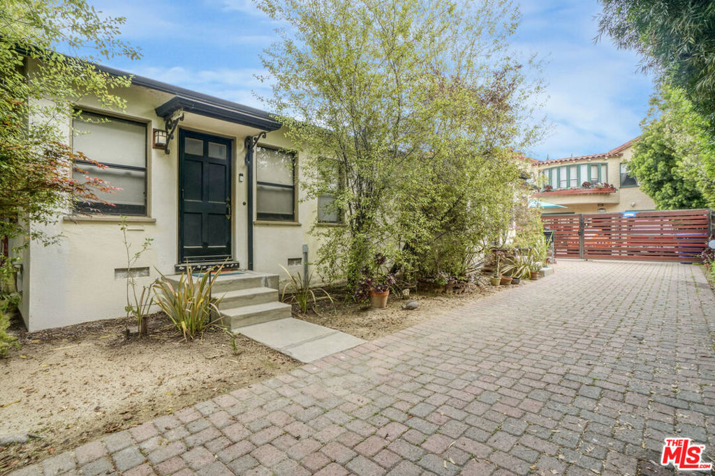 Opportunity knocks!!! Welcome to this rare investment opportunity in the heart of downtown Culver City with a well-maintained, income-producing property just steps from the city's premier dining, shops, and top-rated schools. Offering a blend of comfort, scale, and unbeatable location, this property is ideal for investors, owner-users, or those pursuing a 1031 exchange. The front of the property features two charming original 1-bedroom units, each approximately 600 Sq Ft. Both are tenant-occupied and offer steady income, with hardwood floors, and in-unit washer and dryer, and private outdoor areas. At the rear of the property sits a spacious 5-bedroom, 2-bathroom home (built in 1931), approximately 1,800 Sq Ft, which will be delivered vacant making it perfect for an owner-user looking to live onsite while collecting rent, or for maximizing rental potential. The rear, private home features multiple living areas, ample natural light, its own washer and dryer, and direct yard access ideal for families, shared living, or even creative office space. Altogether, the property offers 2,980 Sq Ft of living space and sits on a generous 6,752 Sq Ft lot, providing both indoor comfort and valuable outdoor flexibility. Additional features include off-street parking, mature landscaping, and R3 zoning for future development potential. Whether you're looking to expand your portfolio or put down roots in a vibrant, walkable neighborhood, this triplex delivers on both lifestyle and investment value. Situated just blocks from Culver Steps, Apple HQ, Sony Studios, and the Metro E Line, residents enjoy seamless connectivity and a strong local rental market.