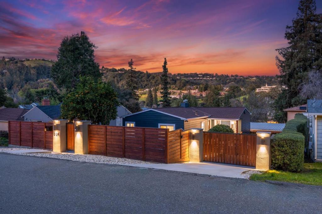 Views of the Oakland hills, a studio ADU (nanny, rental, multigenerational) and a 4 car garage (TWO level 2 EV chargers) with workshop large enough to fit an RV/boat. This home preserves the charm of bay area mid century architecture and is nestled in Eastmont Hills on a quiet established end street with a redwood fence around the property and automatic driveway gate. Access to King Estate, a 52 acre open space with off leash dogs, the best views during July 4, and even baby goats roaming in the summer. Fresh and remodeled, ALL appliances convey. Ensuite and 1/2 bath could be a flexible family room, home gym, guest bedroom, or work from home office. The garden includes raised beds, redwood planters, as well as fruiting citrus orange and lemon trees. Quick access to the 580 and Oakland Zoo adds to the convenience of this prime location, with new shops and community spaces in development at Oak Knoll. Security system centrally monitored conveys.