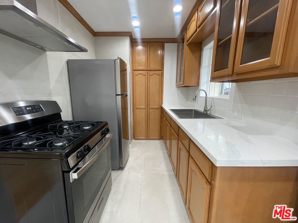 This charming 8-unit building, located on a quiet street in the heart of West Hollywood, offers a beautifully updated 1-bedroom, 1-bathroom unit on the lower floor. Enjoy the convenience of being just moments from top dining, grocery, and coffee spotsincluding Target, Trader Joe's, Sprouts, Starbucks, and Tartine.Inside, the unit features real hardwood flooring, recessed lighting throughout, crown molding, brand-new stainless steel appliances, and new countertops in the kitchen. The bathroom has been completely renovated, showcasing custom tile work and a sleek LED mirror. The spacious bedroom includes a cedar-lined closet with built-in storage, and a new air conditioning unit ensures comfortable living year-round. Water and trash are included, and parking is available for an additional fee.