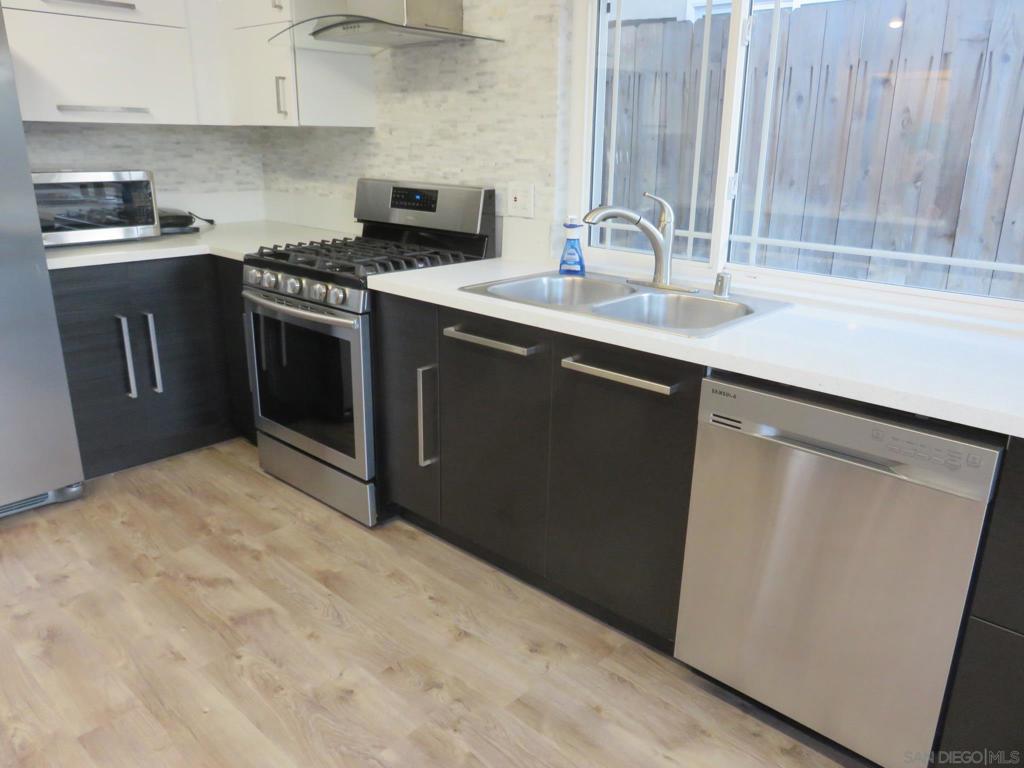 Single story with 2 car garage; Recently remodeled home; Contemporary Design & Decor; European cabinets & soft closing drawers; Quartz countertops & stainless appliances including wine cooler; Vinyl plank & tile flooring; Spacious backyard with lush greeneries; Newer dual-paned windows; Centrally located; within walking distance to schools, parks, library & amenities. Sorry. no pets please. Do not disturb current tenants. Sewer: Sewer Connected