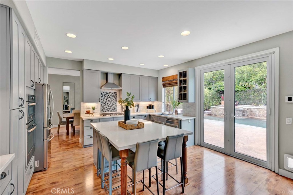 Welcome to 11665 Allen, a Fully Remodeled Turn-Key Dream Home Located in the Highly Sought-After Gated Community of Columbia Westmont in Tustin Ranch. This Immaculate Home Showcases Six Bedrooms, Four Bathrooms (Main Floor Bedroom is Currently Used as an Office), LVP Floors, New Carpet, Newer Exterior/Interior Paint, Resort-Style Backyard, and Numerous Upgrades Throughout! The Living Room Features Ample Natural Light and Opens to the Formal Dining Room with Backyard Access. The Remodeled Kitchen Includes Stainless Steel Appliances, 5 Burner Gas Stove, Large Island with Seating, Quartz Counters, Subway Tile Backsplash, and French Door Backyard Access. The Expansive Family Room Boasts a Cozy Fireplace, Backyard Views, and Opens to the Kitchen, Perfect for Entertaining. The Master Suite Includes a Private Balcony and Remodeled En-Suite Bathroom with Dual Vanities, Floor-to-Ceiling Tile, Walk-In Shower with Frameless Glass Enclosure, Soaking Tub, and Walk-In Closet with Sauna. The Private Backyard is an Entertainer’s Dream, Complete with a PebbleTec Pool/Spa, Water Slide, Built-In BBQ with Bar Seating, Covered Patio with TV, Turf, Lush Landscaping, and Overhead String Lights. Indoor Laundry Room with Built-In Cabinets and Sink. Direct Access Two Car Garage with Built-In Shelves. Just Minutes from Award Winning Tustin Unified Schools. Short Walk to Citrus Ranch/Cedar Grove Parks, and Short Drive to Peters Canyon & Irvine Regional Parks, Tustin Ranch Golf Club, Tustin Sports Park, Plus Tustin/Irvine Marketplace. Easy Access to 241/261 Toll Roads and 5/55/405 Freeways. Do Not Miss Out on 11665 Allen!