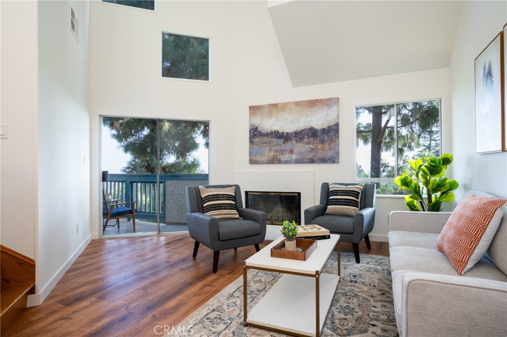 Discover elevated coastal living in this light-filled 2-bedroom, 2-bath top-floor corner unit located in the sought-after gated community of Harbour Walk in San Pedro—a historic harbor town now buzzing with exciting new world-class waterfront developments. Inside, 1,156 square feet of thoughtfully designed space offers modern comfort and flexibility. Each bedroom enjoys its own spacious en-suite bathroom for maximum privacy, while upstairs a versatile loft provides the perfect spot for a home office, creative studio, or yoga retreat. A hidden bonus nook off the loft adds extra storage or a cozy reading escape. This residence stands apart with soaring vaulted ceilings, minimal shared walls, and sweeping 270-degree vistas. From every window you’ll take in dramatic views of Downtown Los Angeles, the San Gabriel Mountains, the iconic Vincent Thomas Bridge, and the sparkling harbor lights. Community amenities include a resort-style pool, spa, and sauna, plus secure gated entry and two parking spaces. Step outside and you’re moments from local markets, acclaimed restaurants, the vibrant LA Waterfront, and easy freeway access for a quick commute to the South Bay or Downtown LA. Whether you’re seeking a primary residence or a savvy investment in one of the South Bay’s fastest-growing coastal neighborhoods, 1441 Brett Place #345 delivers unmatched privacy, panoramic views, and the best of San Pedro living.