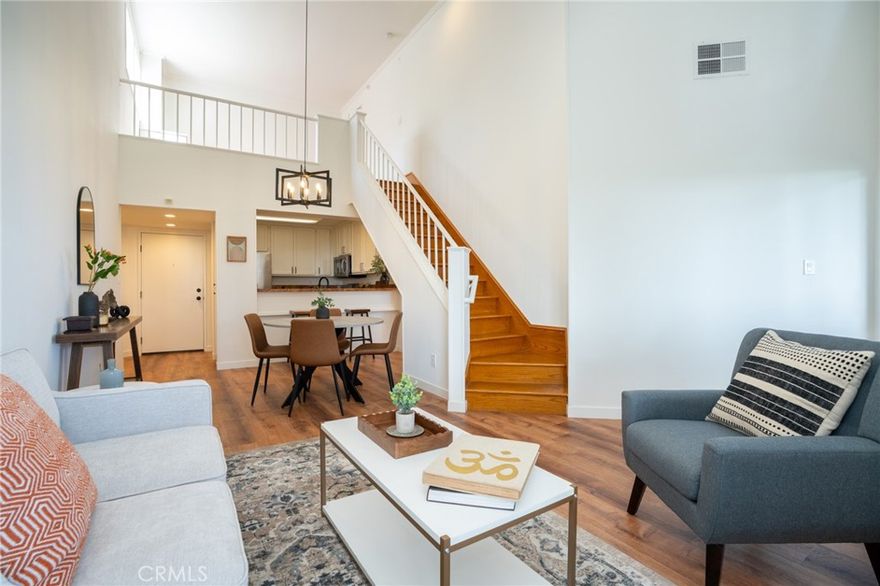 Discover elevated coastal living in this light-filled 2-bedroom, 2-bath top-floor corner unit located in the sought-after gated community of Harbour Walk in San Pedro—a historic harbor town now buzzing with exciting new world-class waterfront developments. Inside, 1,156 square feet of thoughtfully designed space offers modern comfort and flexibility. Each bedroom enjoys its own spacious en-suite bathroom for maximum privacy, while upstairs a versatile loft provides the perfect spot for a home office, creative studio, or yoga retreat. A hidden bonus nook off the loft adds extra storage or a cozy reading escape. This residence stands apart with soaring vaulted ceilings, minimal shared walls, and sweeping 270-degree vistas. From every window you’ll take in dramatic views of Downtown Los Angeles, the San Gabriel Mountains, the iconic Vincent Thomas Bridge, and the sparkling harbor lights. Community amenities include a resort-style pool, spa, and sauna, plus secure gated entry and two parking spaces. Step outside and you’re moments from local markets, acclaimed restaurants, the vibrant LA Waterfront, and easy freeway access for a quick commute to the South Bay or Downtown LA. Whether you’re seeking a primary residence or a savvy investment in one of the South Bay’s fastest-growing coastal neighborhoods, 1441 Brett Place #345 delivers unmatched privacy, panoramic views, and the best of San Pedro living.